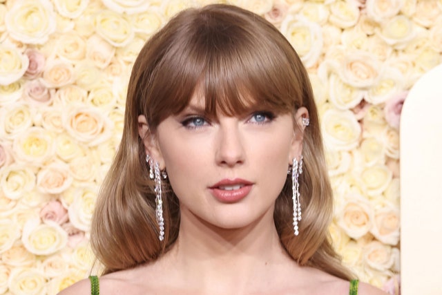 Taylor Swift went full bombshell at the Chiefs game in a corset top and thigh-high boots